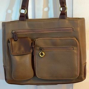 Medium size tan purse with long shoulder strap